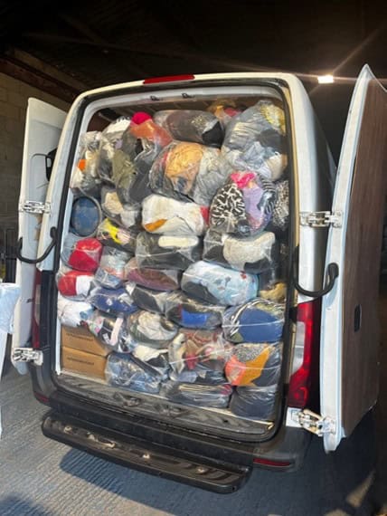 Van full of clothes in bags