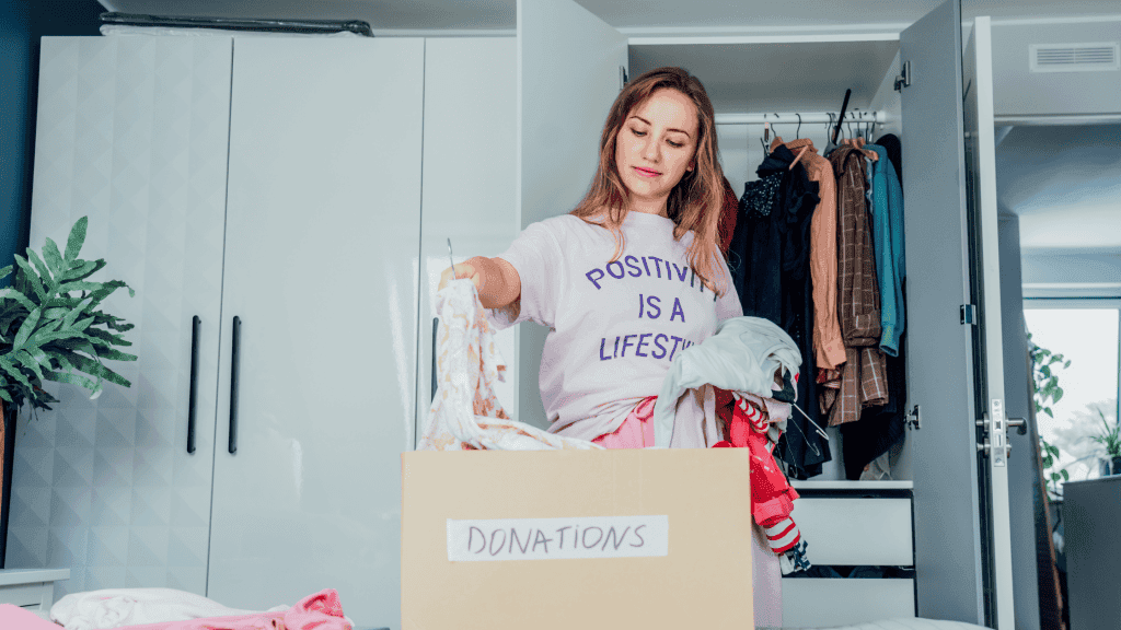 Charity donations being packed into a box in Greater London.