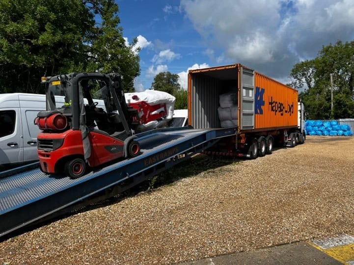 lorry being loaded with botany bags