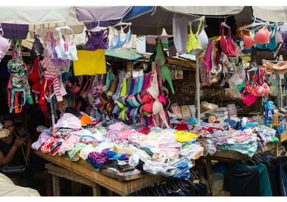 Market stall of textiles being sold. After Distribution process