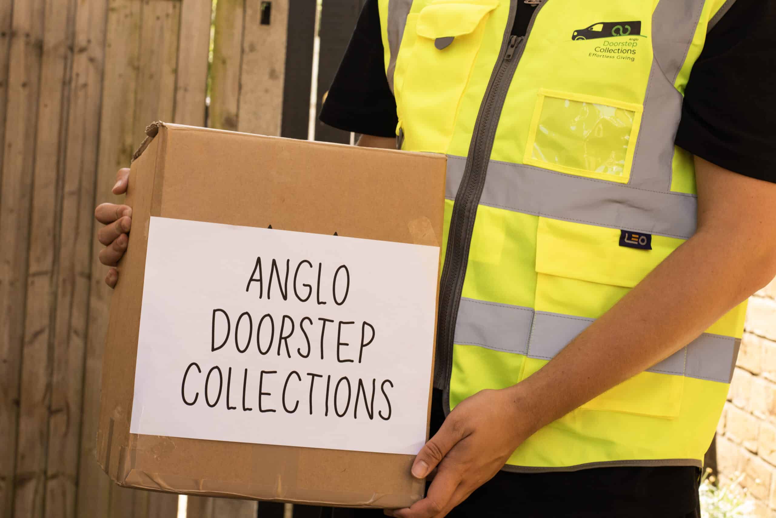 Anglo doorstep collections driver collecting clothing donations in the UK, England.