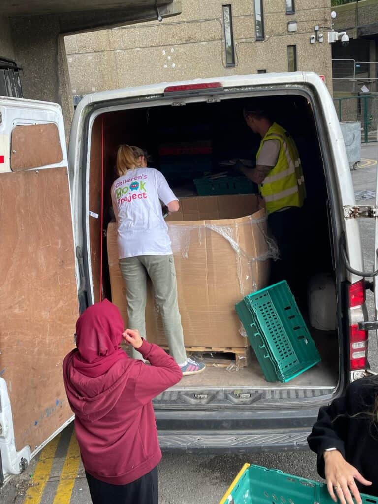 unloading donations at their london warehouse.