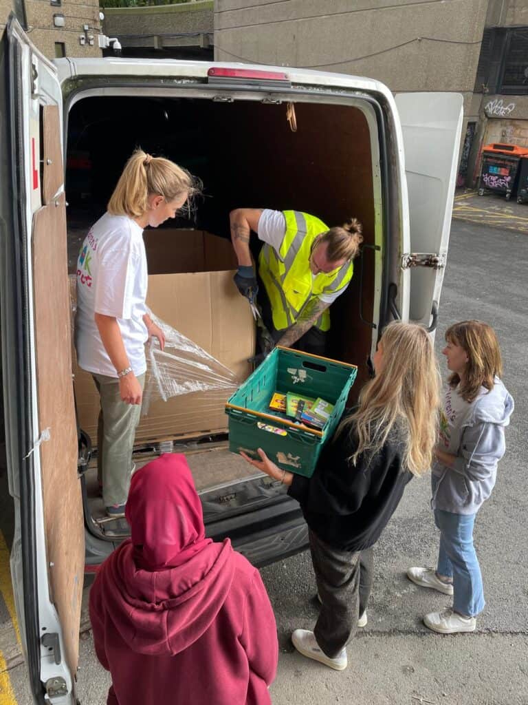 unloading donations to the children's book project.